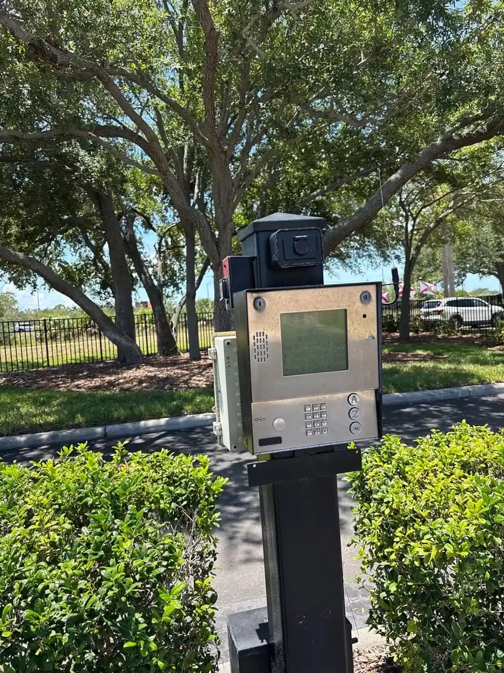 Telephone entry call box on a post at a gate in Pinellas Park, FL